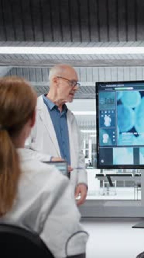 Vertical Video University Professor Mentoring Young Researchers About Molecular Biology
