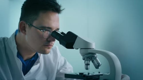 Close Up Portrait of Medical Research Scientist Male Conducting Medical Test