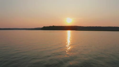sunset lake aerial shot majestic sun