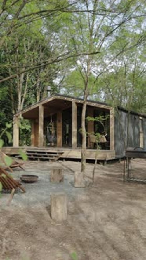 Vertical Video Discover a Modern EcoFriendly Cabin Nestled in a Serene Forest Setting That Inspires