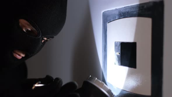 Robber Cracking Safe with Flashlight at Night, People Stock Footage ft ...