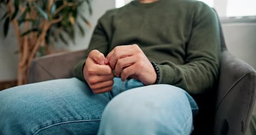 Doctor, man hands and waiting room with anxiety, stress and contemplating about health results