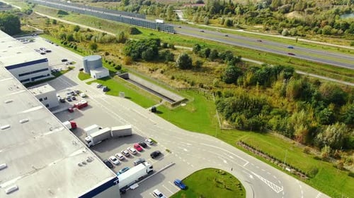 Aerial view of modern storage warehouse. Logistics center in industrial city zone from drone view. B