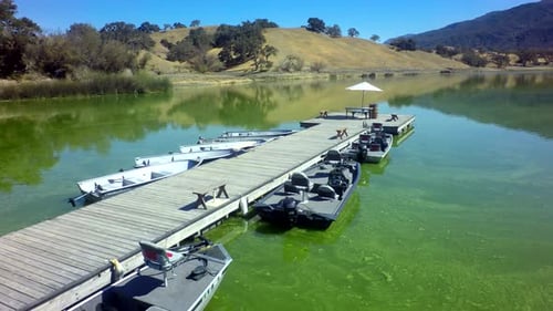 View of Gorgeous Mountainside Lake on Sunny Day by Aerial Drone Above