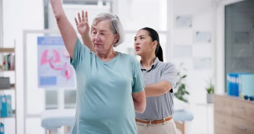 Senior Woman Working on Range of Motion in Clinic