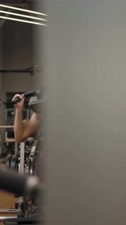 Strong Woman Doing Leg Exercises at the Gym