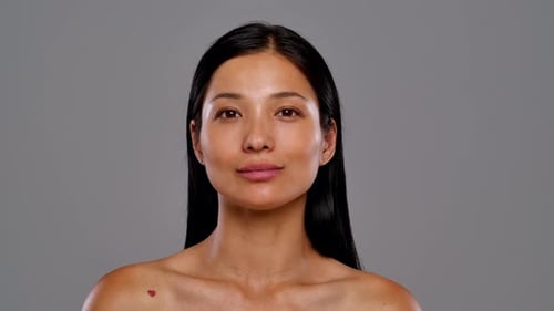 Woman Poses Close Up in Studio