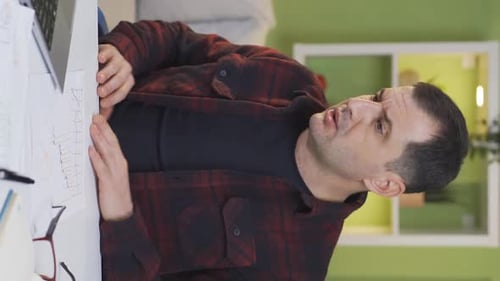 Man At Desk Thinking or Stressed