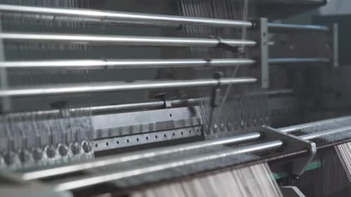 Industrial Loom Weaving Fabric at a Textile Factory