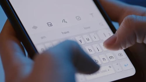 Fingers Typing on a Mobile Phone Keyboard