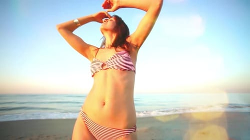 Woman Dancing on the Beach