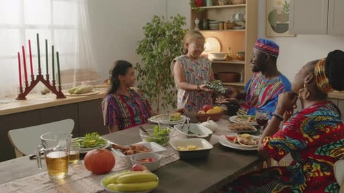 Family Clapping Hands during Meal in Kitchen
