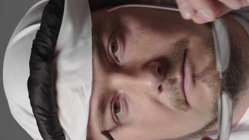 Man with United Arab Emirates Traditional Clothes Posing in a Studio