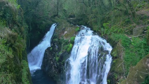Fly Away At Santa Leocadia Waterfall In Tropical Forest Near Mazaricos In Galicia Spain