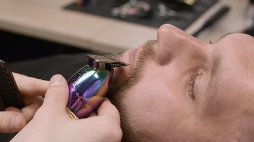 Man Getting Beard Trim at Barber Shop