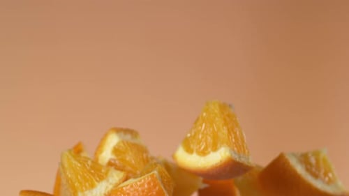 Slow motion oranges levitating against a white background for healthy living