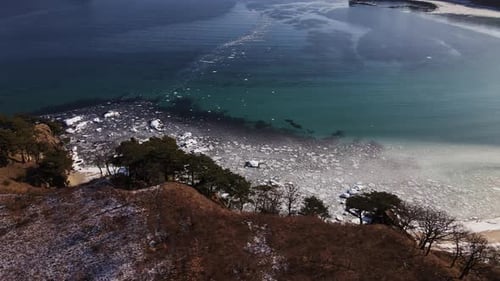 Drone View of Ice Floes Floating in the Sea Near the Shore