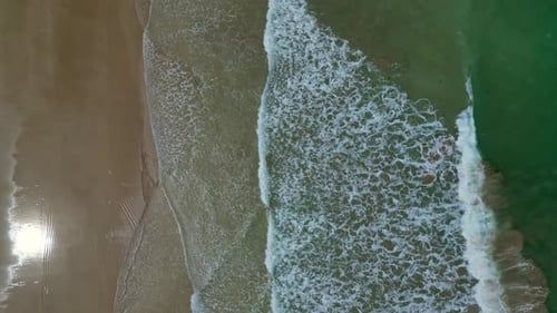 Sea Waves Breaking on Sand Beach