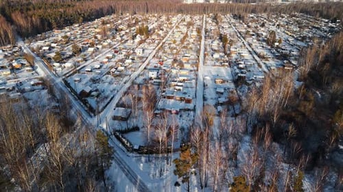Captivating Scenic Aerial View of a Beautiful SnowCovered Suburban Neighborhood in the Winter Season