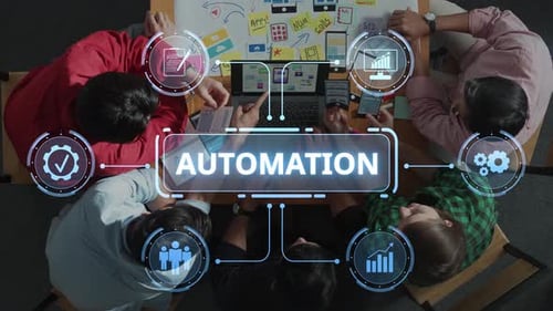 Diverse Team Collaborating on Automation Solutions with Technology Visuals and Flowcharts in Modern
