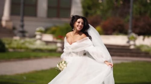 Elegant Bride Runs in Park on Wedding Day