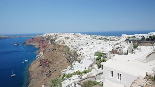 Pan left view of Oia and Santorini caldera, Greece