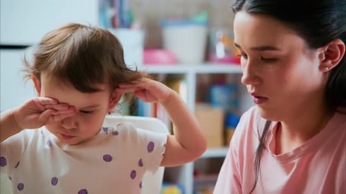 Mother and Toddler Playing with Clay in Home
