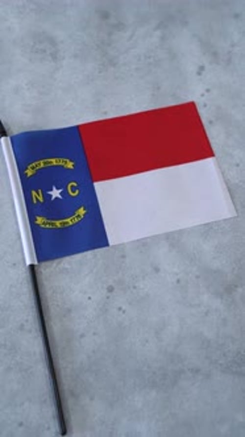 North Carolina State Flag on gray background
