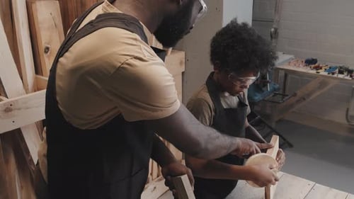 Father and Child Work on Woodworking Project
