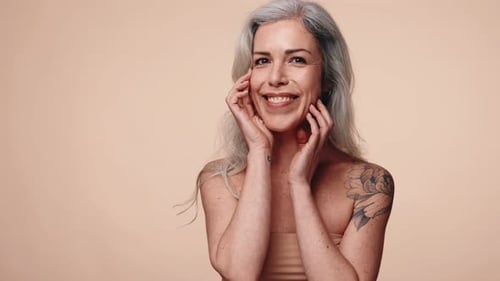 Elegant Senior Woman Smiling, Posing in Studio