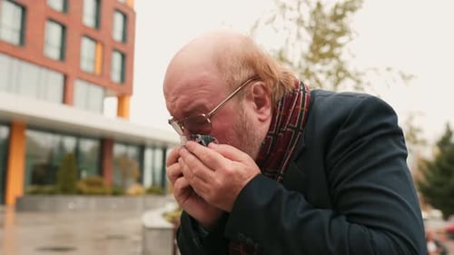 Mature Adult Man Drinking a Beverage Outdoors