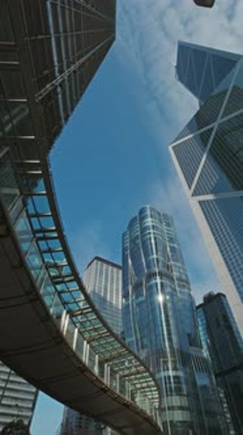 Modern skyscrapers reflect city skyline in bright daylight