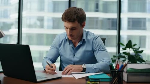 Serious Focused Man Working Laptop Sitting Desk Office Close Up. Portrait Of