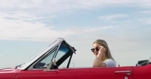 Travel, driving and woman in a car for road trip, vacation or weekend holiday in the coast