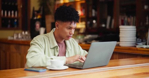 Remote work, planning and man with laptop in coffee shop for freelance job