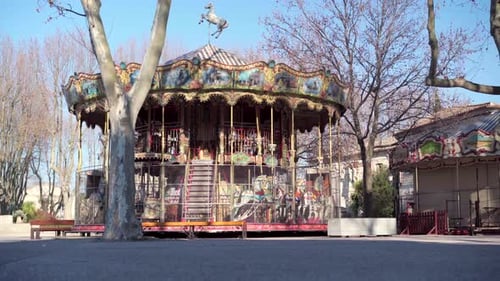 Empty Carousel in Urban Park During the Day