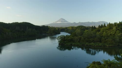 Aerial, Lush Trees Around Lake with Mount Taranaki in Background