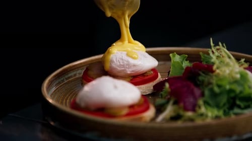 Close Up in a Professional Kitchen on Clean Metal Table a Woman Chef Collects a Salad with Fresh