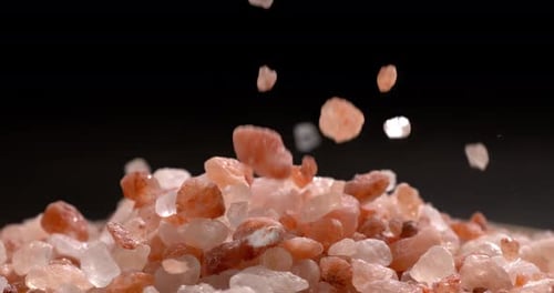 Himalayan pink salt in a super slow motion, natural mineral seasoning for healthy cooking and spa