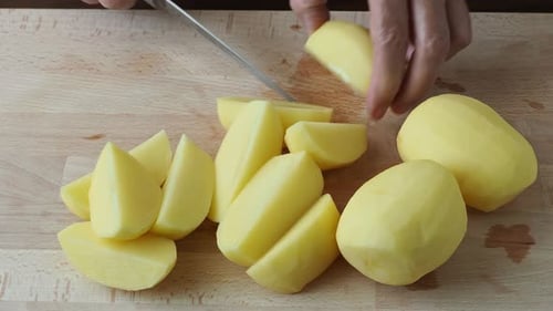 Preparing Fresh Potatoes on Wooden Board