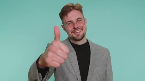 Business Man Raises Thumbs Up Agrees or Gives Positive Reply Recommends Advertisement Likes Good