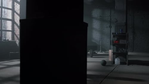 Tired Girl Drinking Water In Sports Bottle At Fitness Training In Dark Gym. Female Athlete Refres...