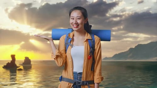 Asian Female Hiker Smiling And Pointing To Side on Beach