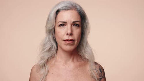 Smiling Woman with Long Gray Hair