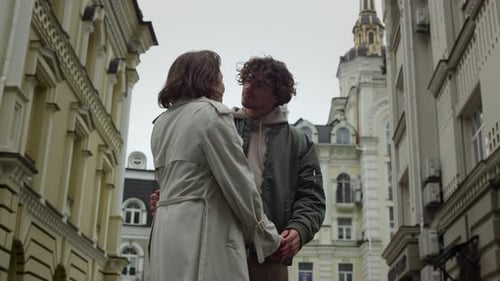 Couple holding hands in urban setting