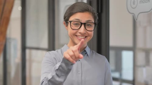Selecting Young Indian Businesswoman Pointing at Camera