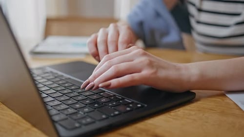 Worker Hands Typing Keyboard Laptop at Wooden Desk Closeup Woman Working Office