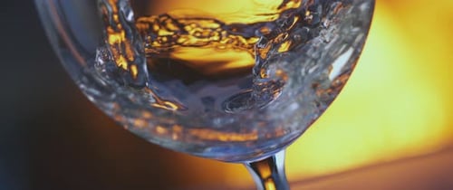 Red wine pouring from bottle