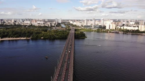 Aerial Drone View Of Paton Bridge In Kyiv Spanning Dnipro River With Cityscape