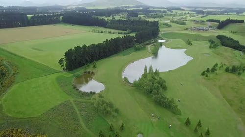 Aerial shot of large golf course with green lawn